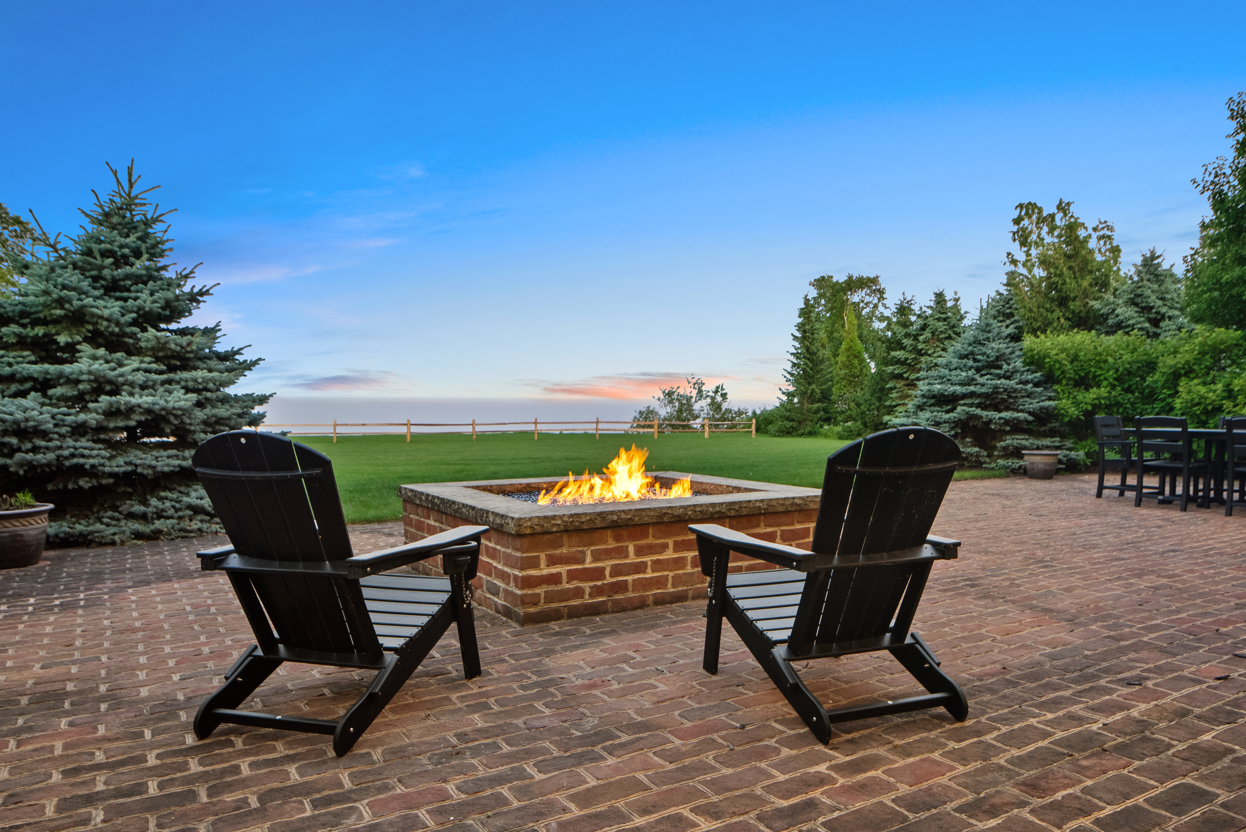 Gas fire pit at dusk overlooking Lake Michigan Wisconsin