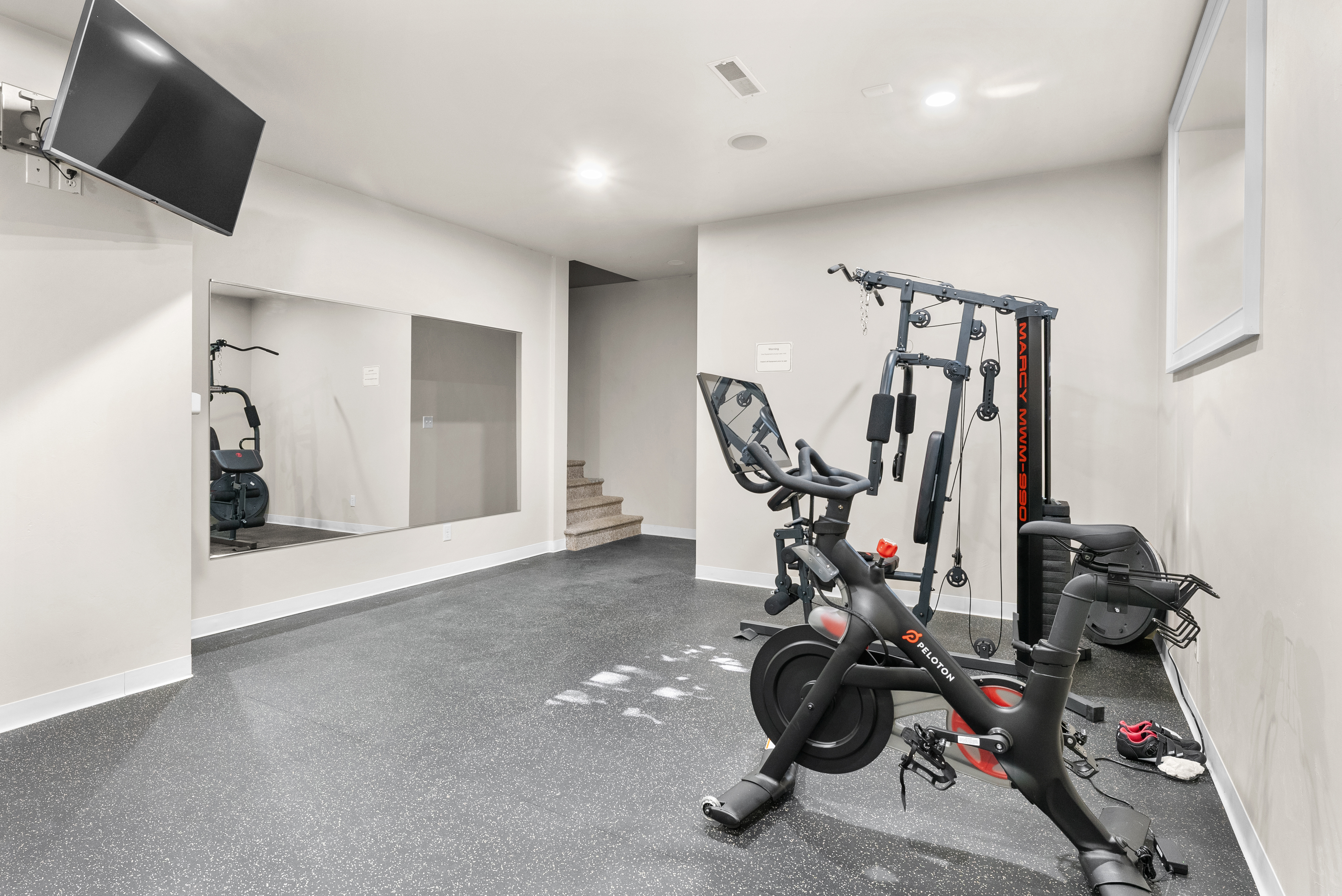 Home gym with Peloton bike at Lake Michigan vacation rental Wisconsin