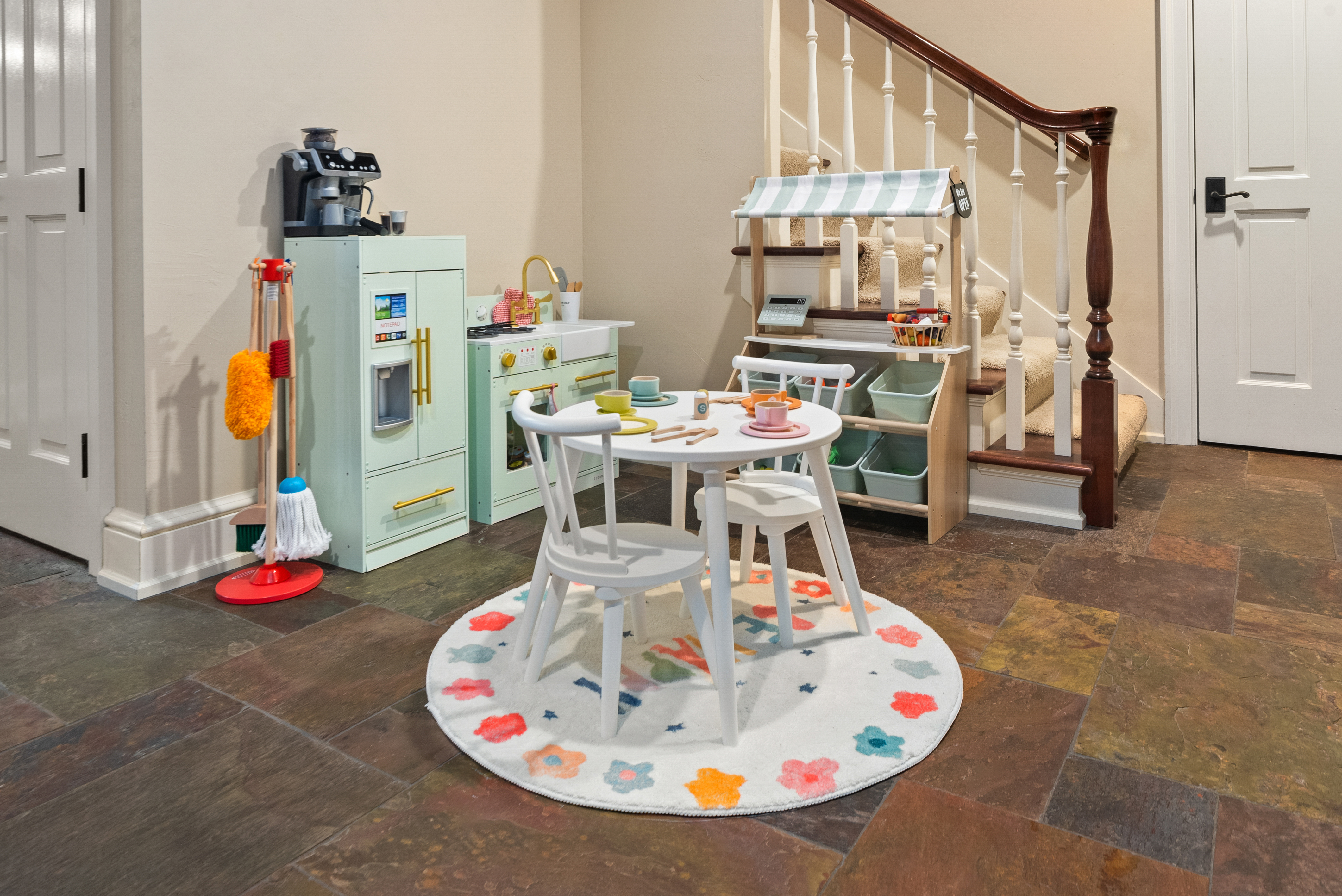 Kids play area with toy kitchen and play market at Evergreen Manor Wisconsin family vacation rental